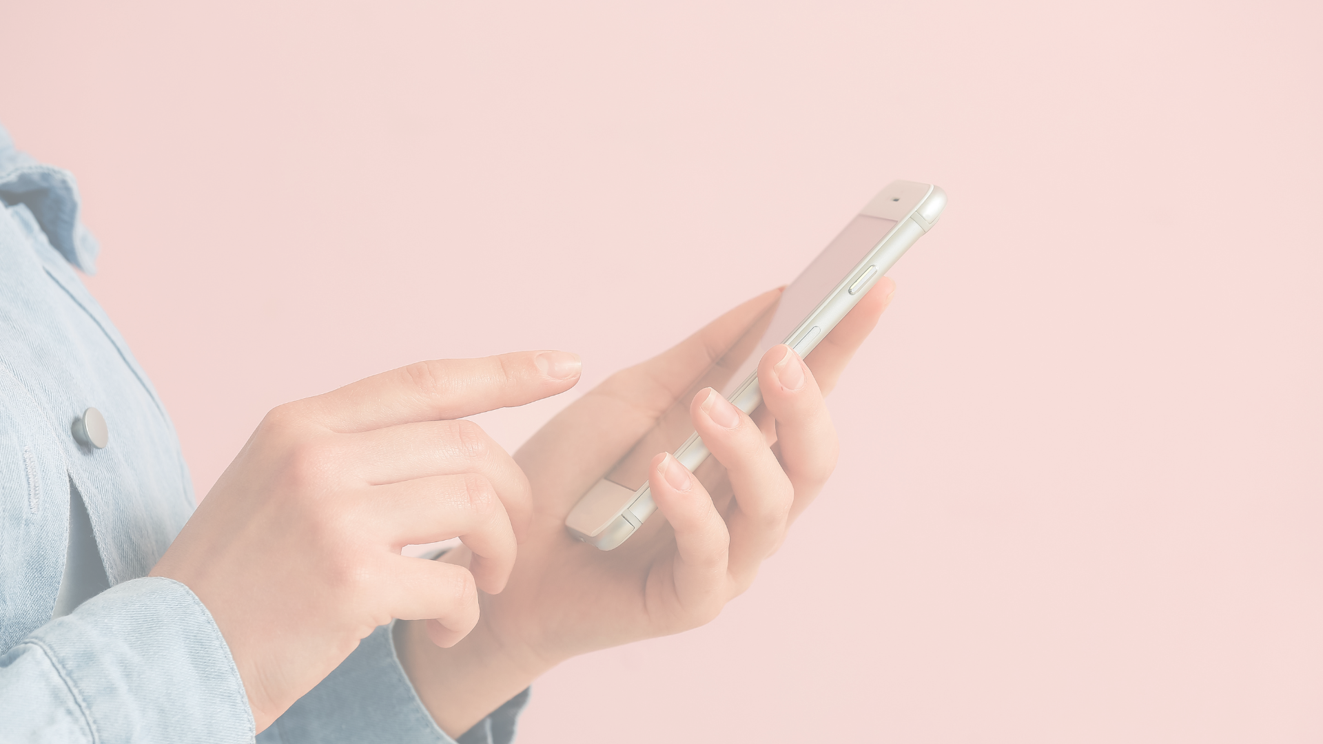 A woman wearing a light denim jacket holds a smartphone and interacts with the screen against a soft pink background. The image conveys a modern, tech-savvy, and stylish feel, aligning with the theme of wardrobe and fashion apps.